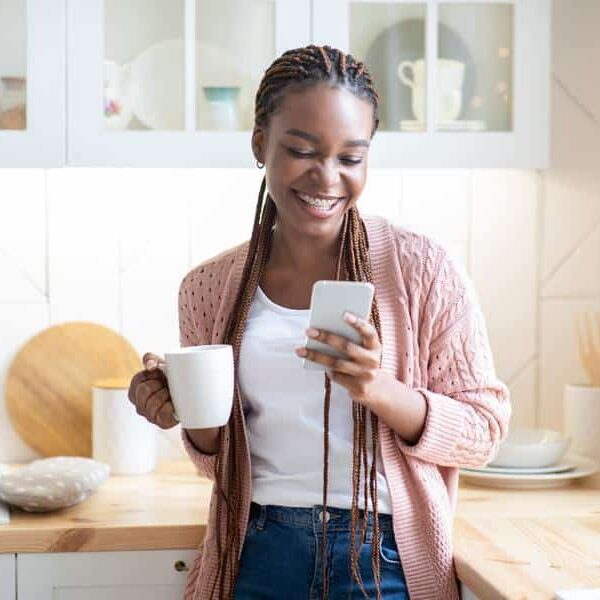 Smiling woman looking at phone