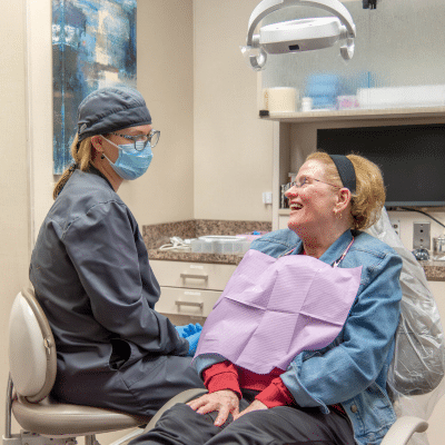 Cosmetic dentistry in charlotte nc 4 Dr. Melissa stewart talking with a patient, representing cosmetic dentistry in charlotte nc